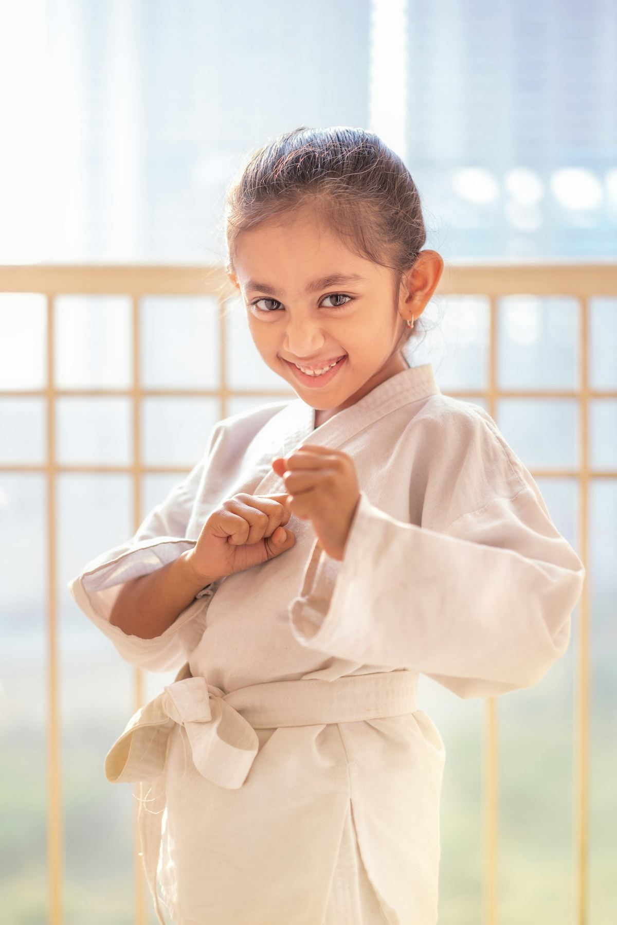 Young student in a white gi